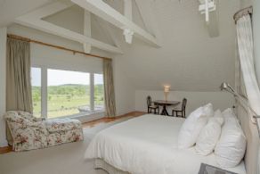 Primary bedroom with vaulted ceilings - Country homes for sale and luxury real estate including horse farms and property in the Caledon and King City areas near Toronto